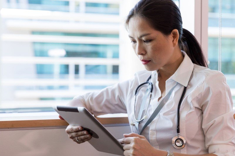 Medic reading on a tablet